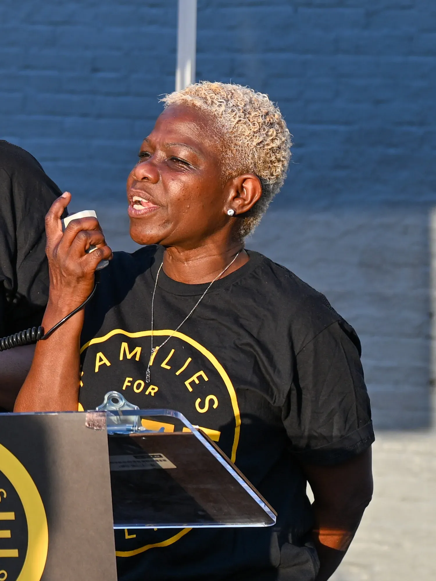 Baltimore Families for Safe Streets Organizer Amril Hamer speaks at a vigil on Orleans Street